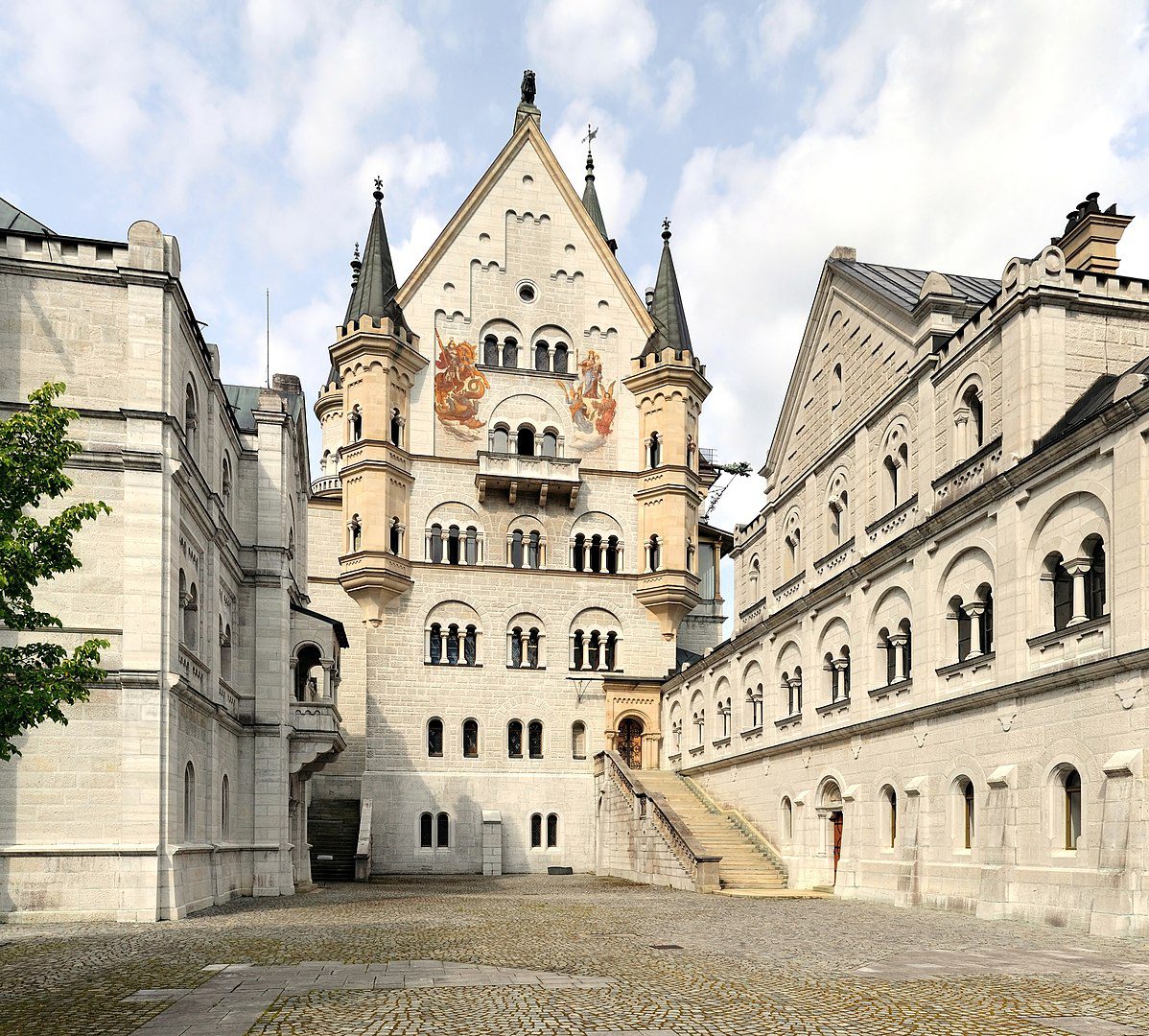 View from location of unrealised chapel along upper courtyard level bower (left), palace front, and knights' house (right)