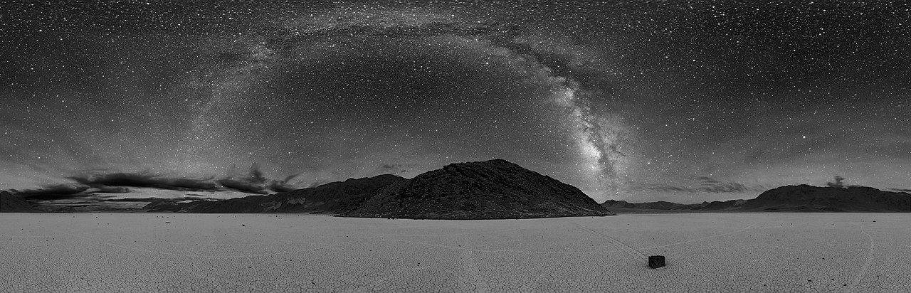 A panorama of the Milky Way with the tracks of sailing stones below Notice the stone on the right sidee