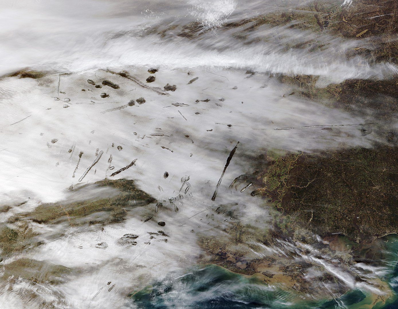 Satellite image of canals and fallstreak holes over east texas and louisiana jan